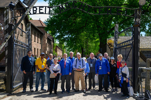President Berman (center) leads a delegation of university presidents to Auschwitz for the 2024 International March of the Living