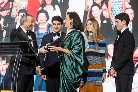 Rabbi Berman presenting the honorary degree to Chella Safra. 